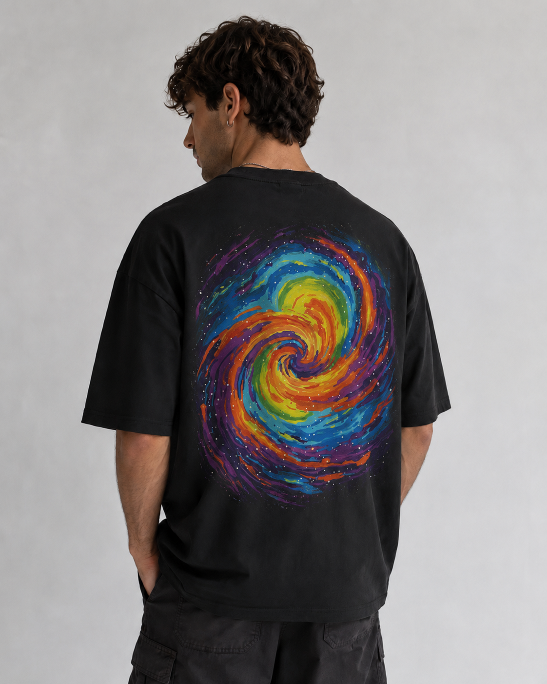 Back view of a man wearing a Seejthreadsflames (STF) black heavyweight cotton oversized hoodie and matching shorts.
