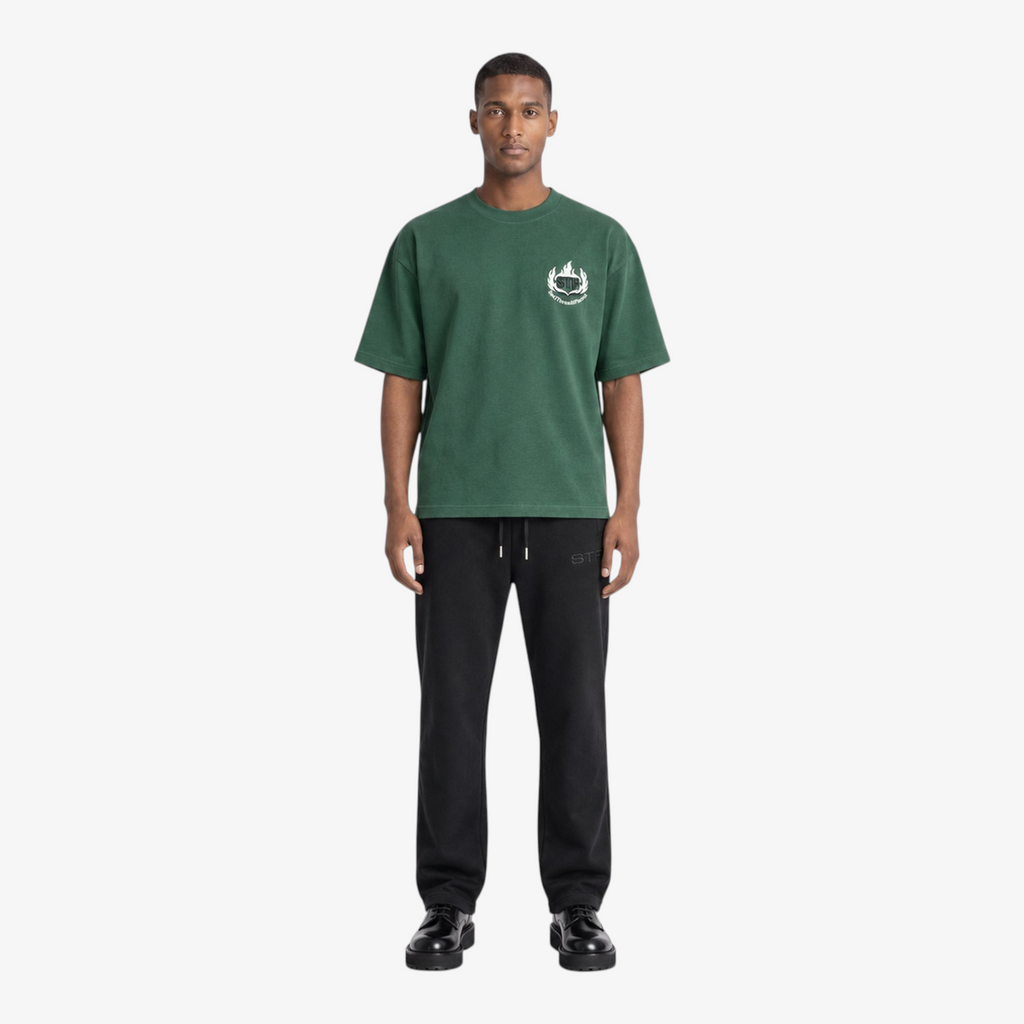 Male model wearing STF forest green flame T-shirt front
