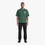 Male model wearing STF forest green flame T-shirt front