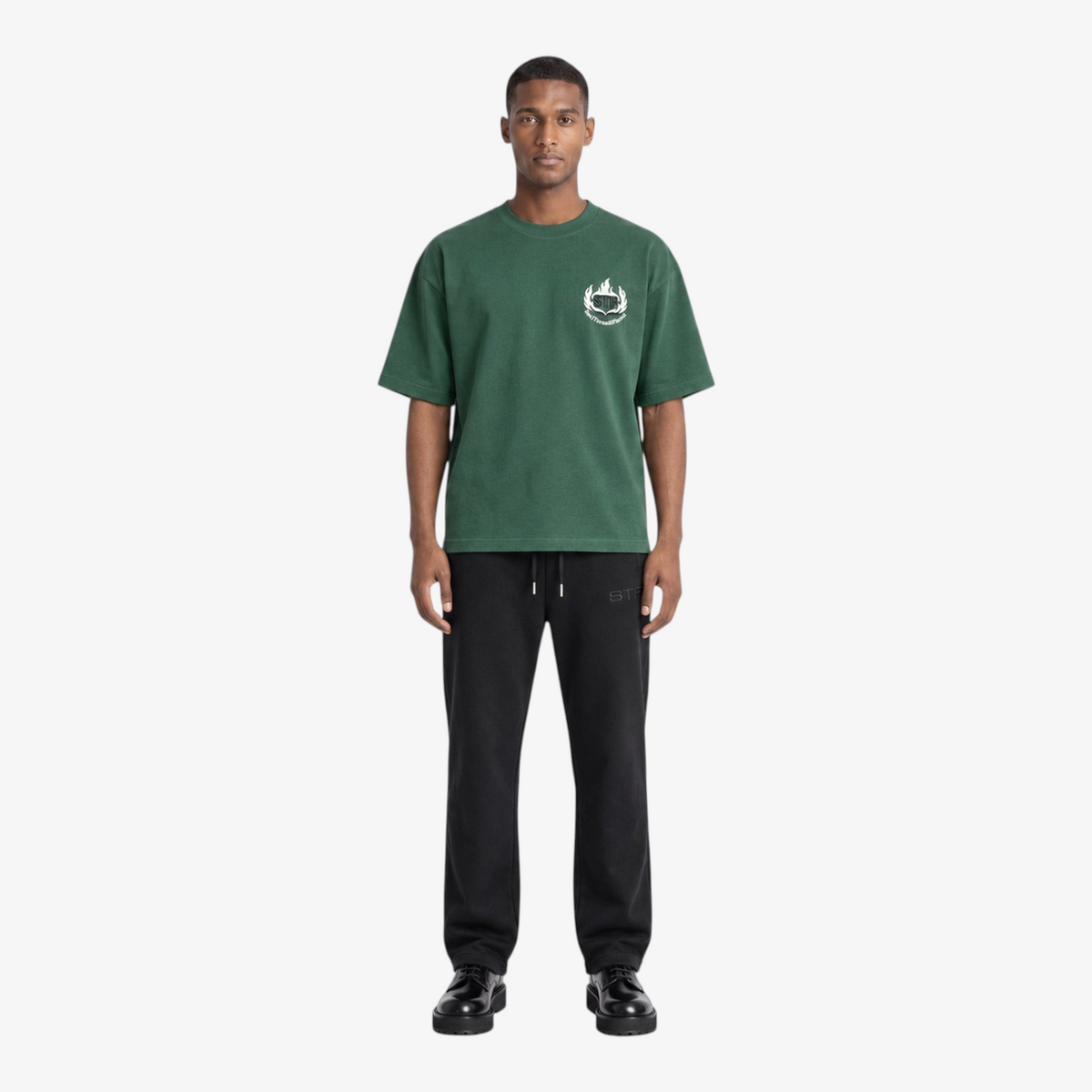 Male model wearing STF forest green flame T-shirt front