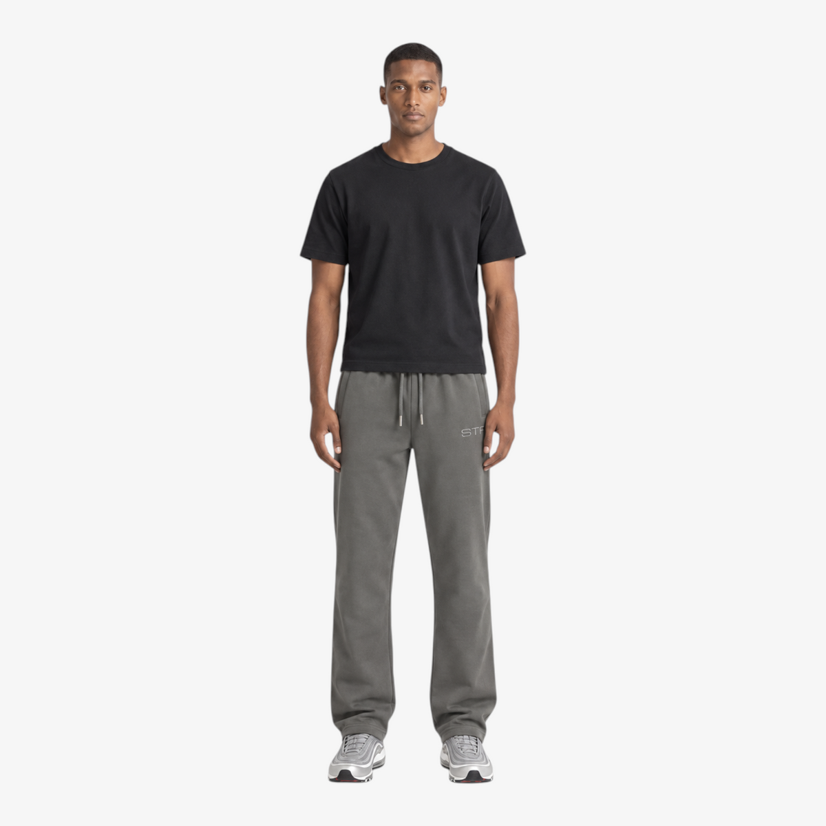 STF grey relaxed open-hem trousers — male front view