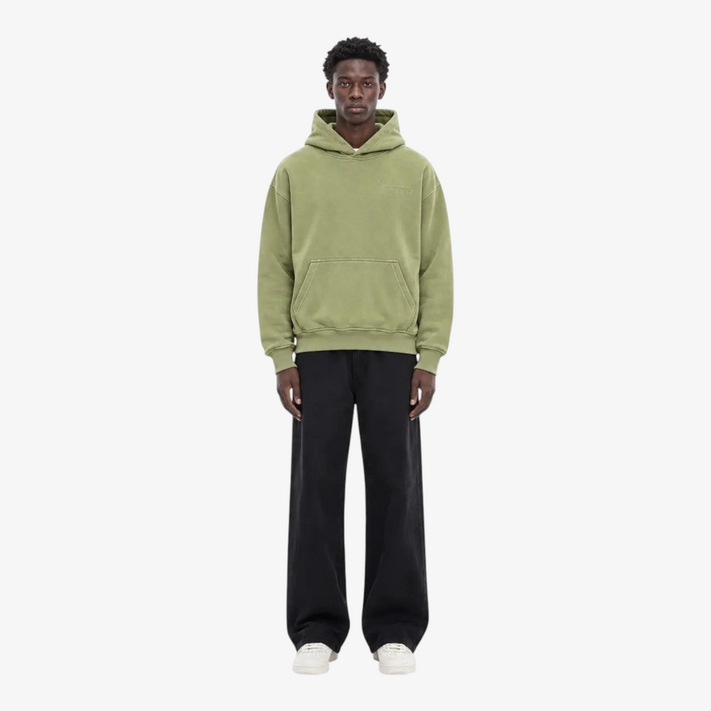 Model wearing STF oversized olive hoodie front view
