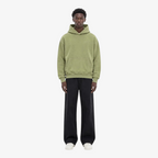 Model wearing STF oversized olive hoodie front view