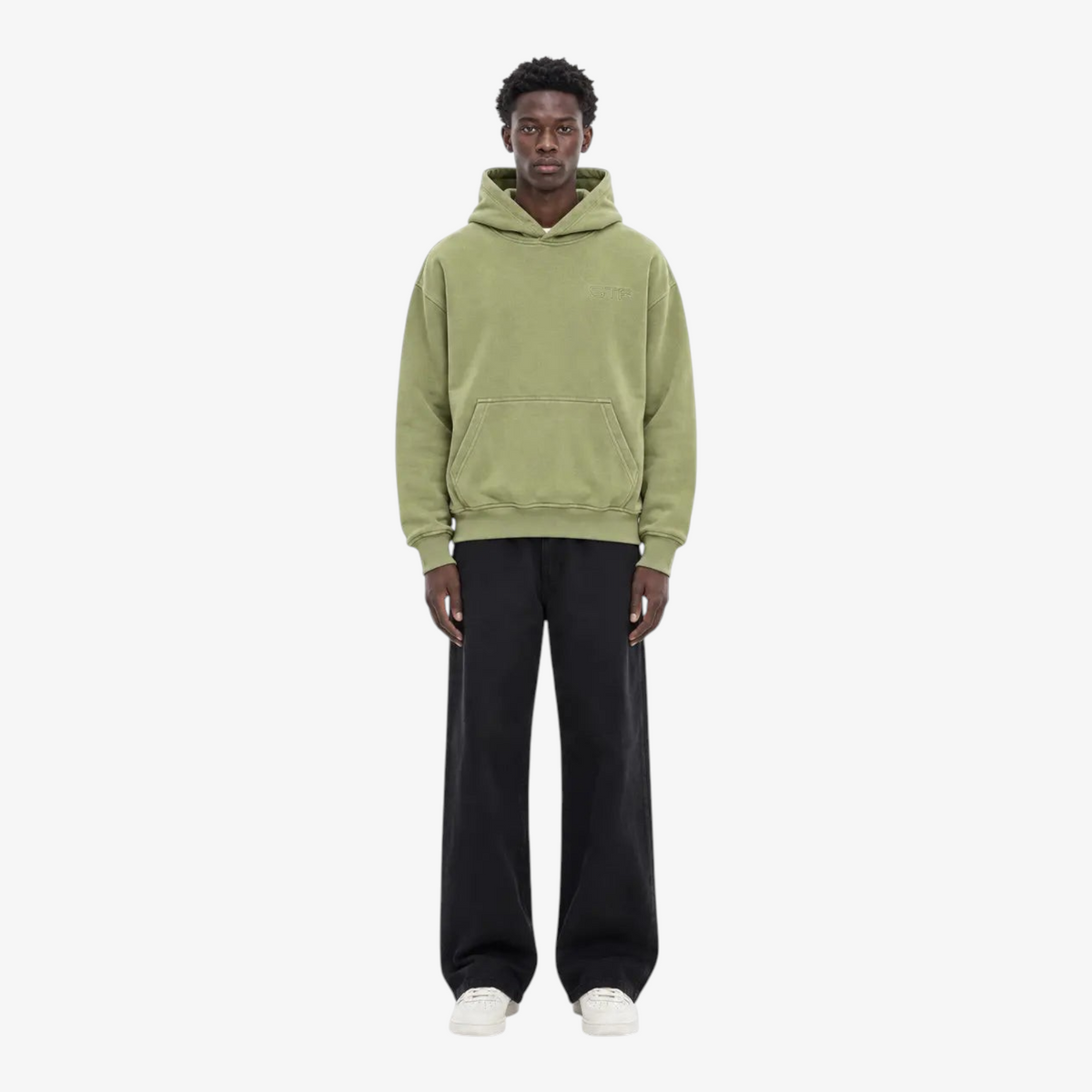 Model wearing STF oversized olive hoodie front view