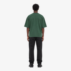 Male model wearing STF forest-green boxy oversized T-shirt back view