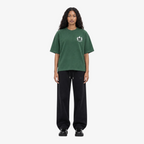 Female model wearing STF forest green flame T-shirt front