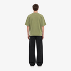 Male model wearing STF boxy oversized olive T-shirt back view