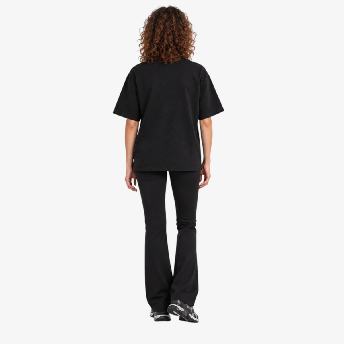 Female model wearing STF black boxy oversized T-shirt back view