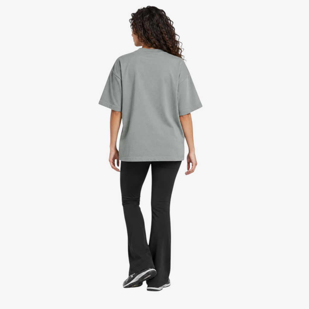 Female model wearing STF sage-grey boxy oversized T-shirt back view