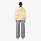 STF oversized boxy hoodie in cream — Female model back view