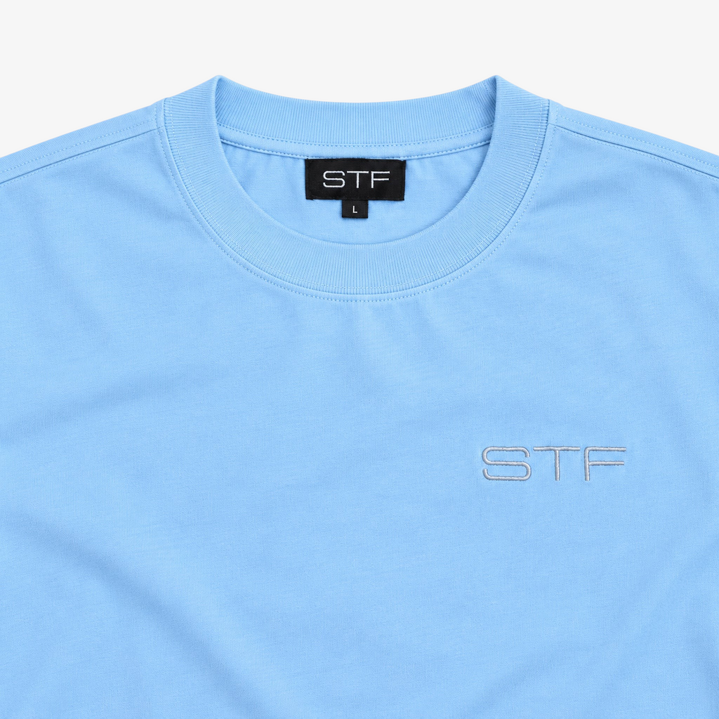 STF sky blue T-shirt collar label and tonal chest embroidery detail