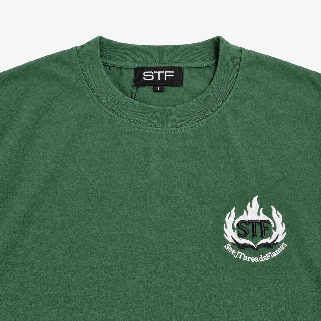 STF forest green T-shirt collar label and flame embroidery detail