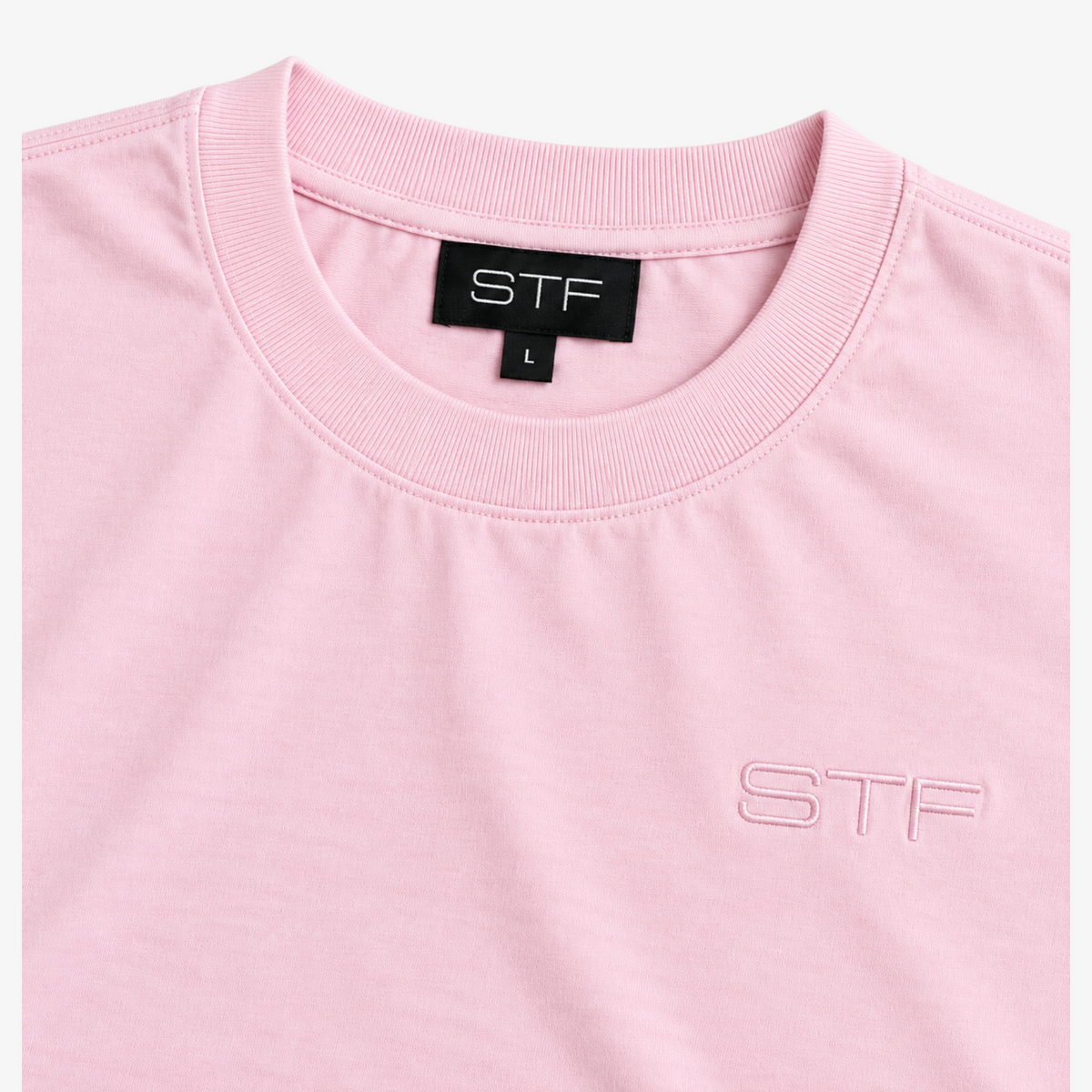 STF oversized tonal T-shirt in light pink — Neckline and tonal embroidery detail