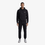 Model wearing a Seejthreadsflames (STF) black heavyweight cotton tracksuit with oversized hoodie and relaxed joggers.
