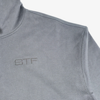 Close-up of Seejthreadsflames (STF) charcoal grey heavyweight French terry hoodie with tonal chest embroidery.