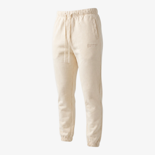 Seejthreadsflames (STF) Essential Jogger in beige heavyweight fabric with elasticated cuffs and tonal embroidery