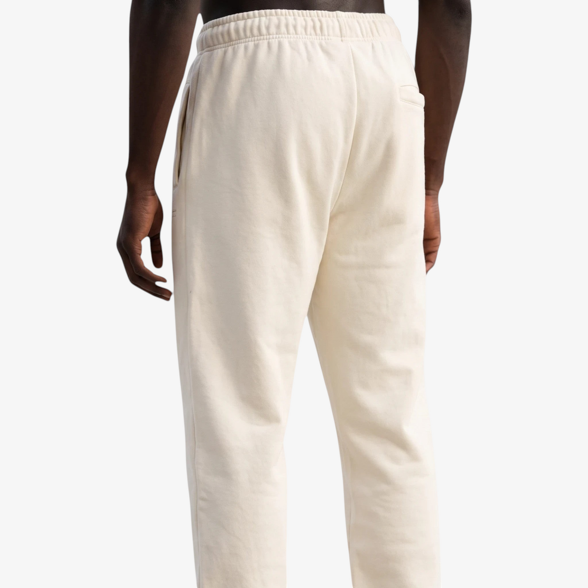 Back view of Seejthreadsflames (STF) cream heavyweight joggers with elasticated waistband and relaxed fit