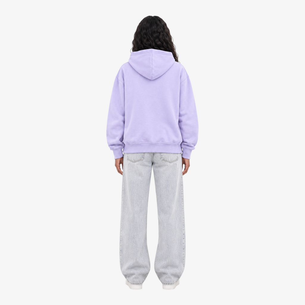 Back view of a person wearing a Seejthreadsflames (STF) lavender pullover hoodie with light wash denim jeans