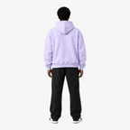 Back view of a man wearing a Seejthreadsflames (STF) lavender pullover hoodie with a hood and ribbed hem.