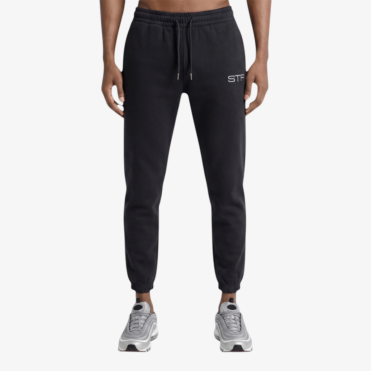 Seejthreadsflames (STF) black French terry joggers with a tapered fit, drawcord waist, and embroidered logo.