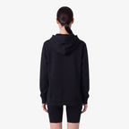 Back view of a Seejthreadsflames (STF) black heavyweight cotton pullover hoodie with an oversized fit.